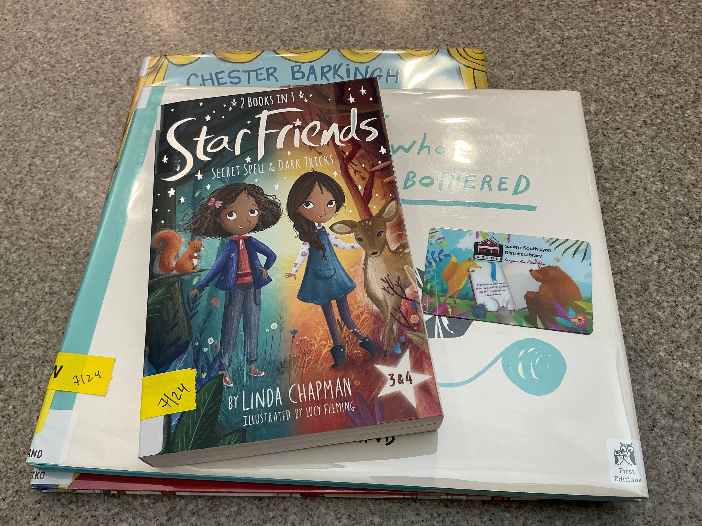 Stack of books with library card